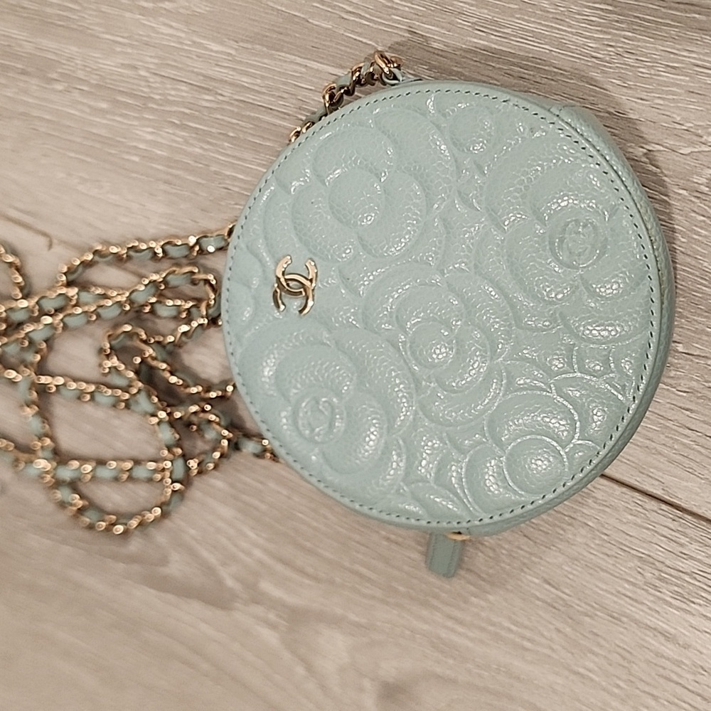 Chanel Caviar Camellie embossed round bag light blue
